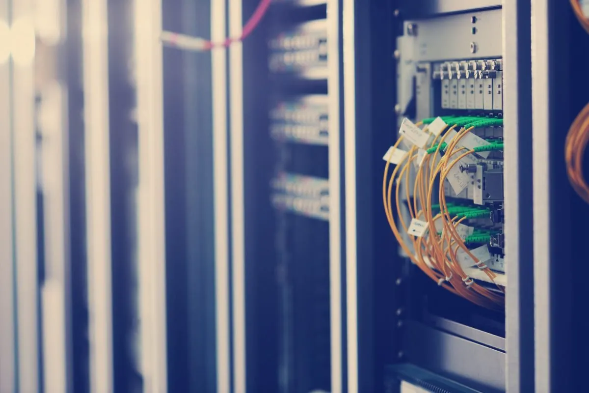 Network cables connected into a server rack
