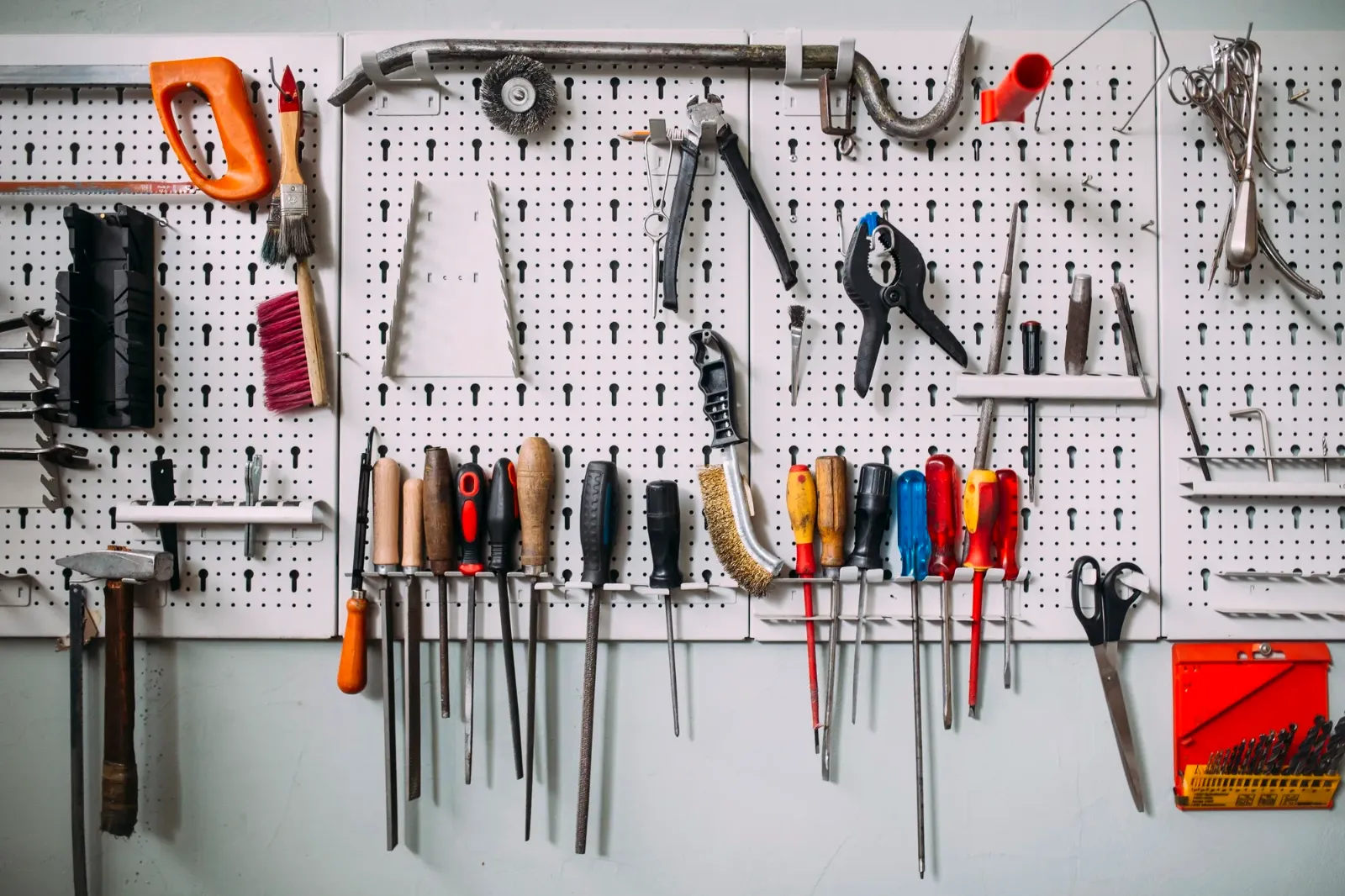A workshop wall crowded with different tools