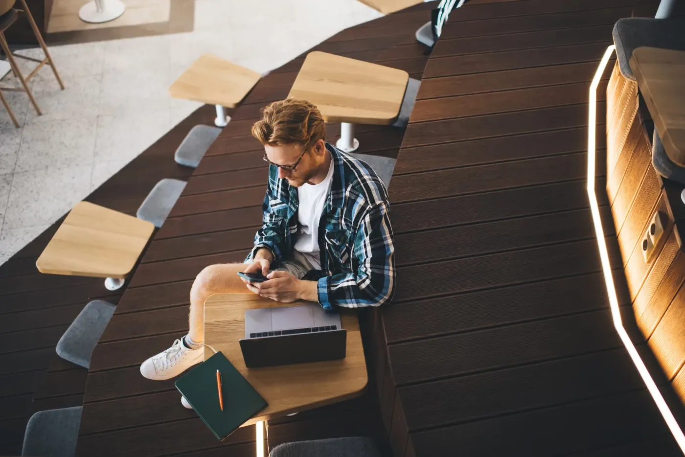 Man on a phone call in a busy coworking space