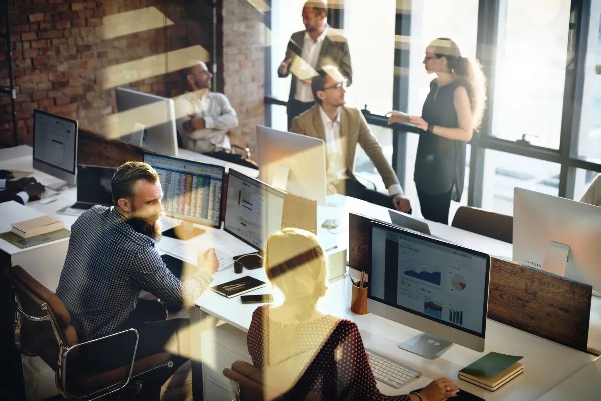 Team working together in an open-plan office