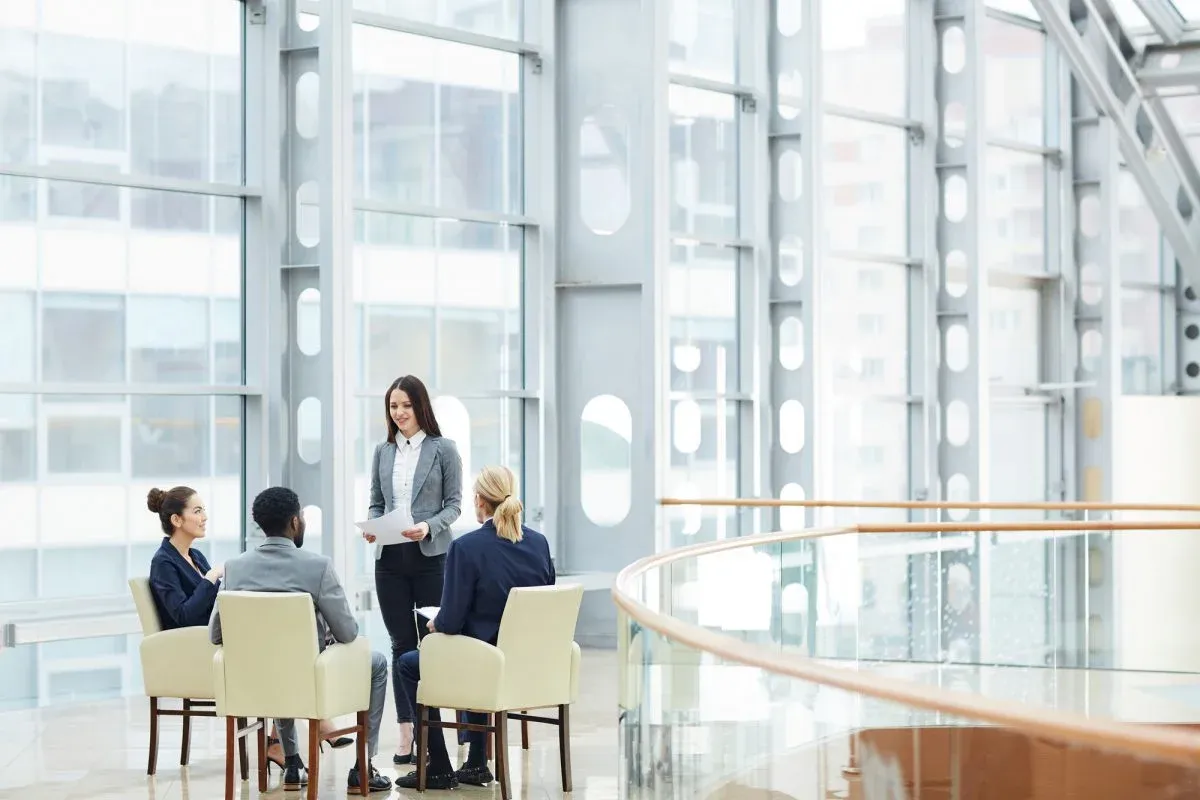 Small meeting in a glass atrium