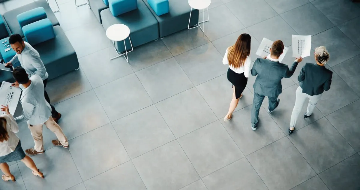 Aerial view of colleagues walking through an office