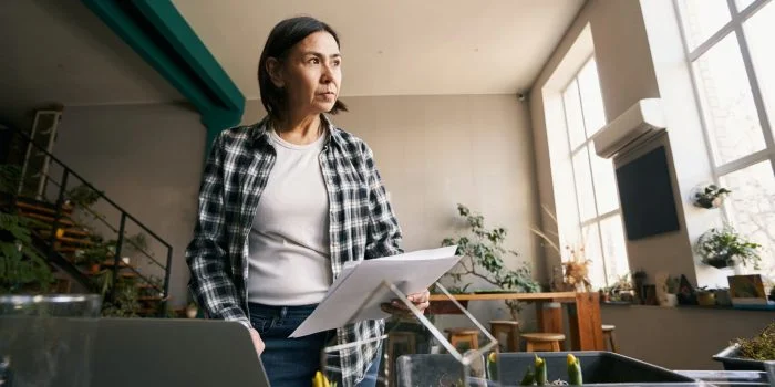Marketer working on a laptop in a bright studio