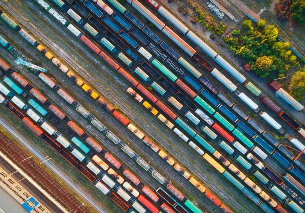 Top view of colorful cargo trains. Aerial view