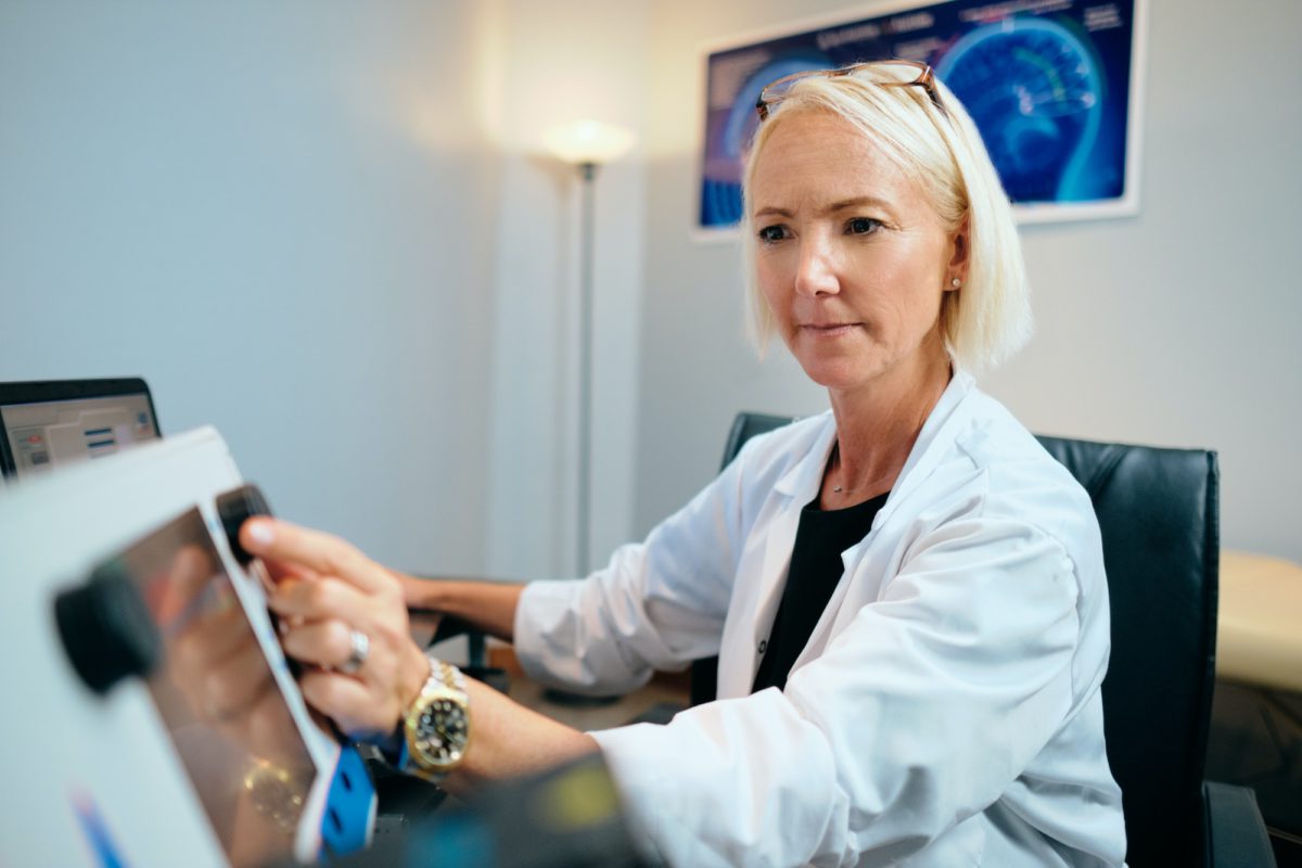 Doctor Woman Working In Hospital Office With Computer Technology Equipment