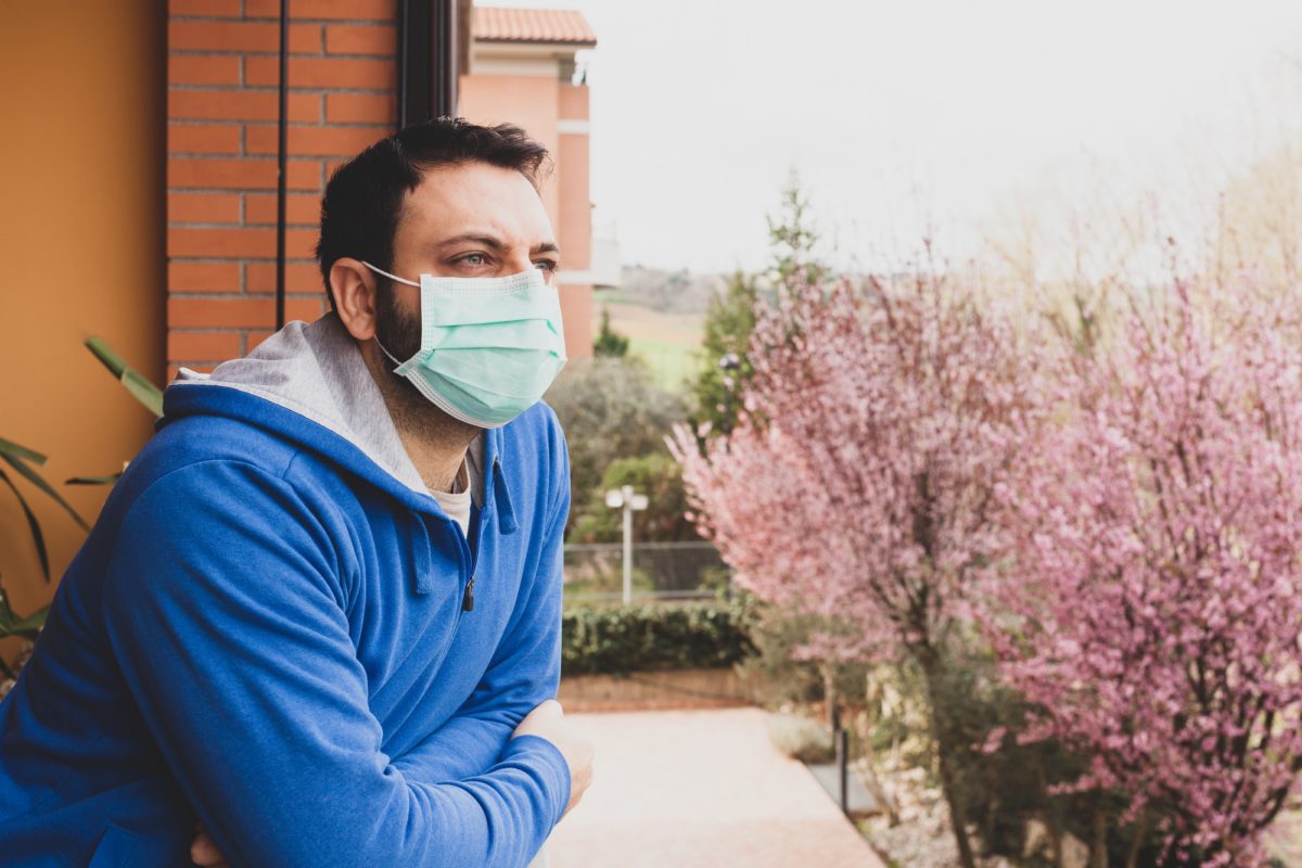 The mask, to avoid infection of the Coronavirus covid 19, hanging on the door handle