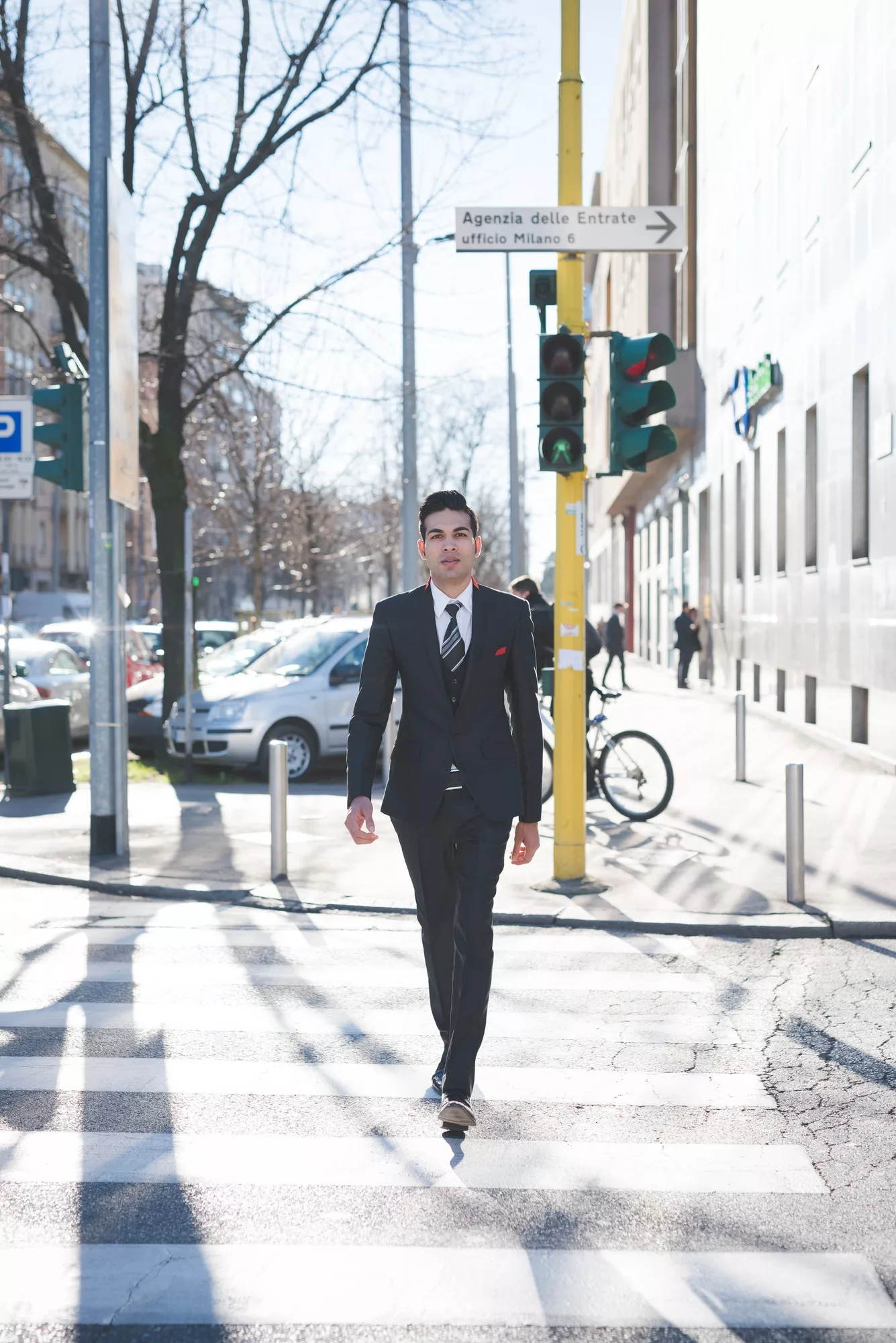 Young businessman in the street, Milan, Italy