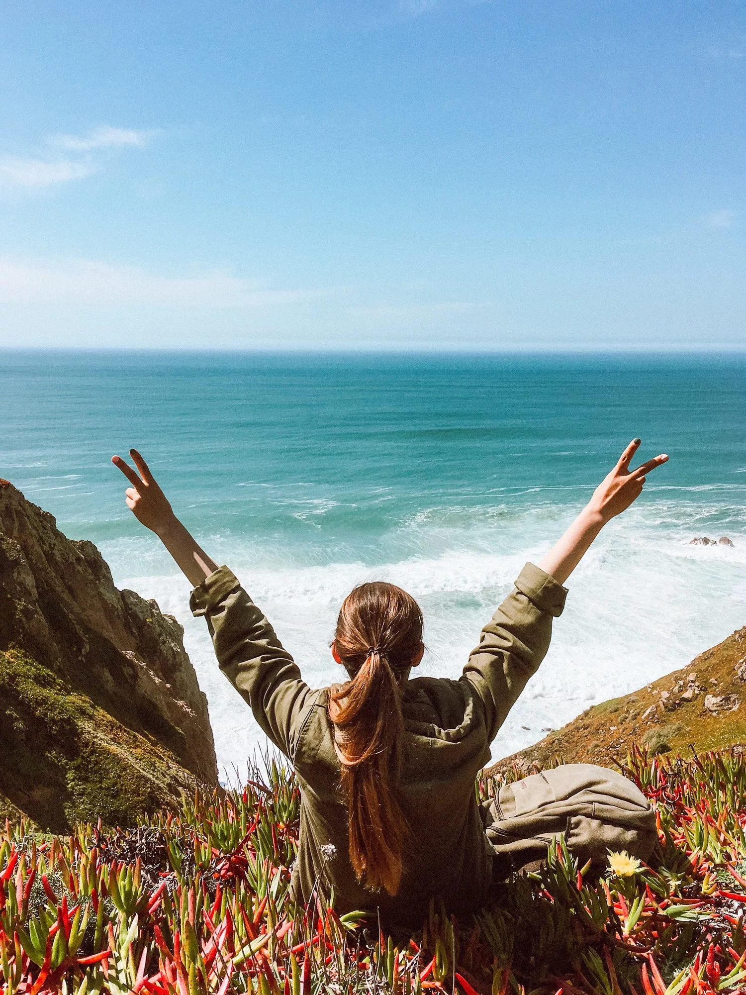 Positive girl enjoys the ocean in Portugal