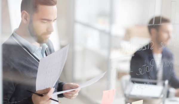 Businessman Calculating Finances