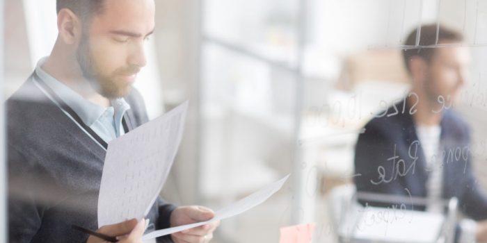 Businessman Calculating Finances