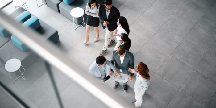 Corporate teamworking colleagues in modern office