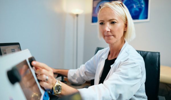 Doctor Woman Working In Hospital Office With Computer Technology Equipment
