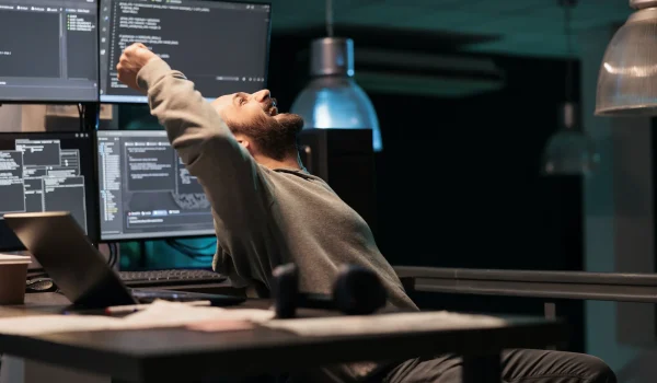 Pleased engineer celebrating ai software victory