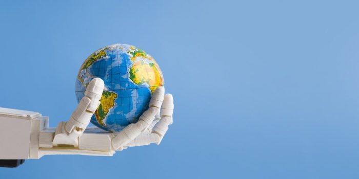 Robot holding Earth globe in hand, blue panorama background