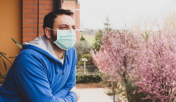 The mask, to avoid infection of the Coronavirus covid 19, hanging on the door handle