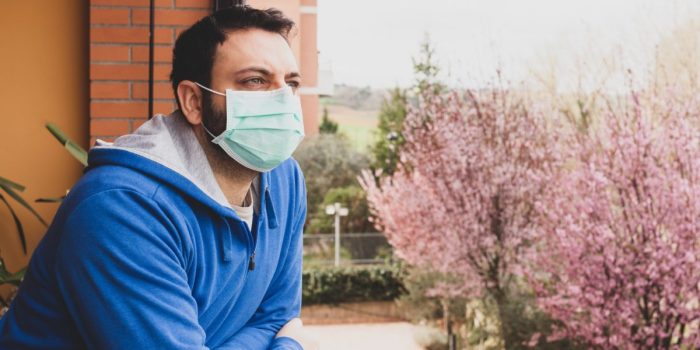 The mask, to avoid infection of the Coronavirus covid 19, hanging on the door handle