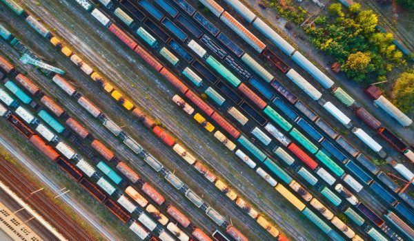 Top view of colorful cargo trains. Aerial view