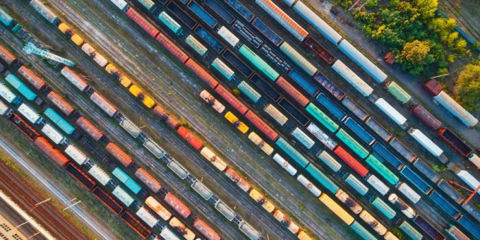 Top view of colorful cargo trains. Aerial view
