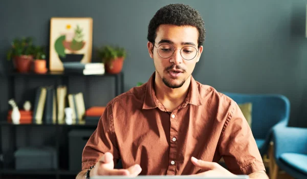 Young businessman or online student communicating with online audience