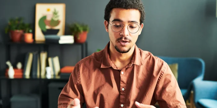 Young businessman or online student communicating with online audience